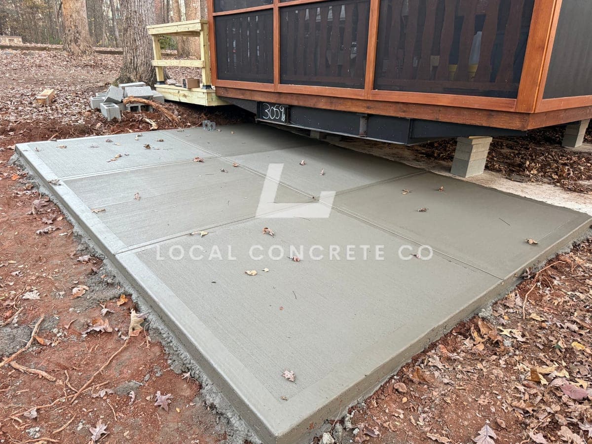 Newly poured Concrete Patios in Charlotte, NC (Mecklenburg County) by Local Concrete Contractor — 4000 PSI mix, double-mat #4 rebar, broom-finish surface, 28-day full cure.
