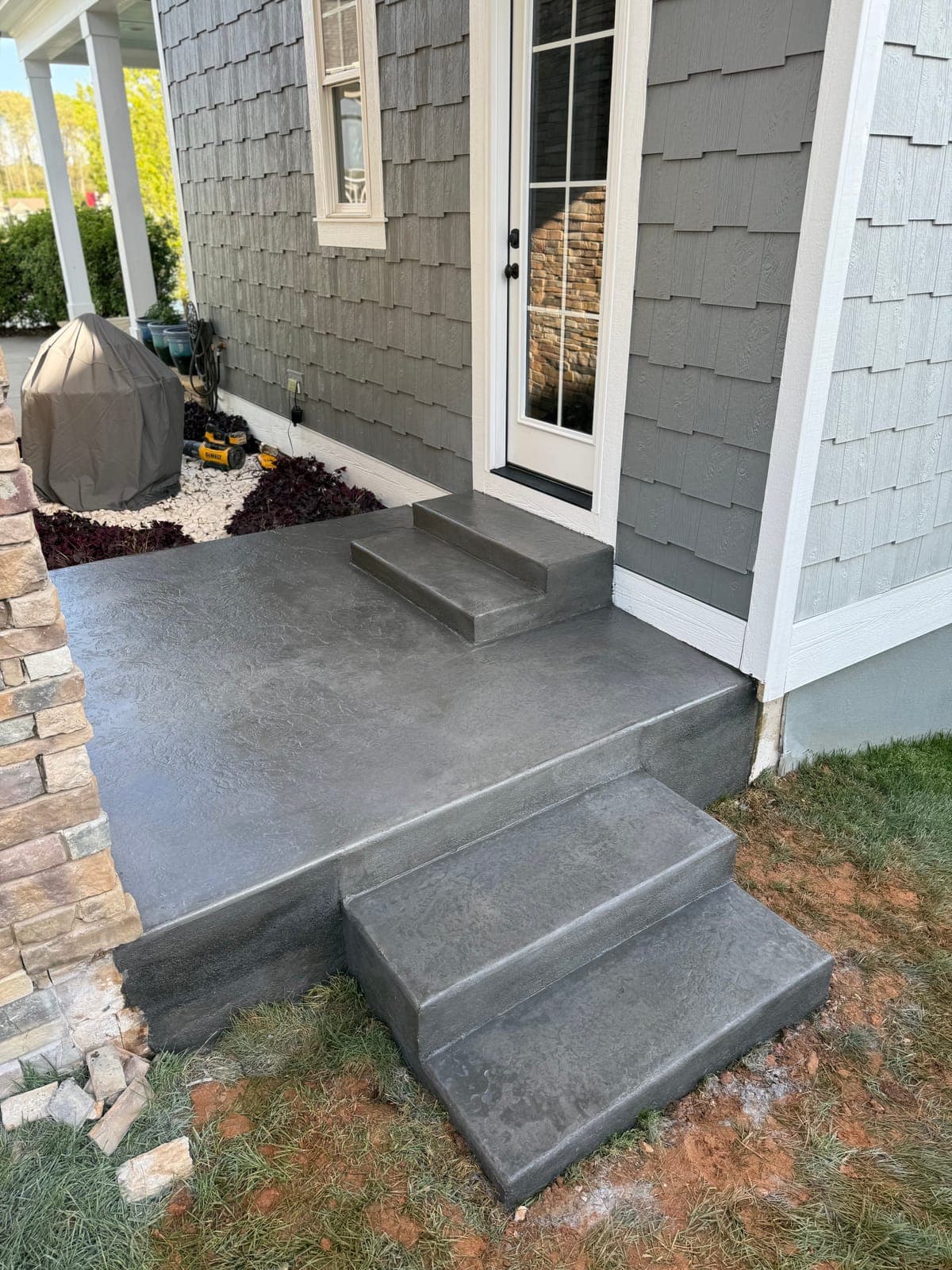 Stamped concrete sidewalk in Durham, NC — decorative pattern, non-slip texture, sealed finish by Local Concrete Contractor.