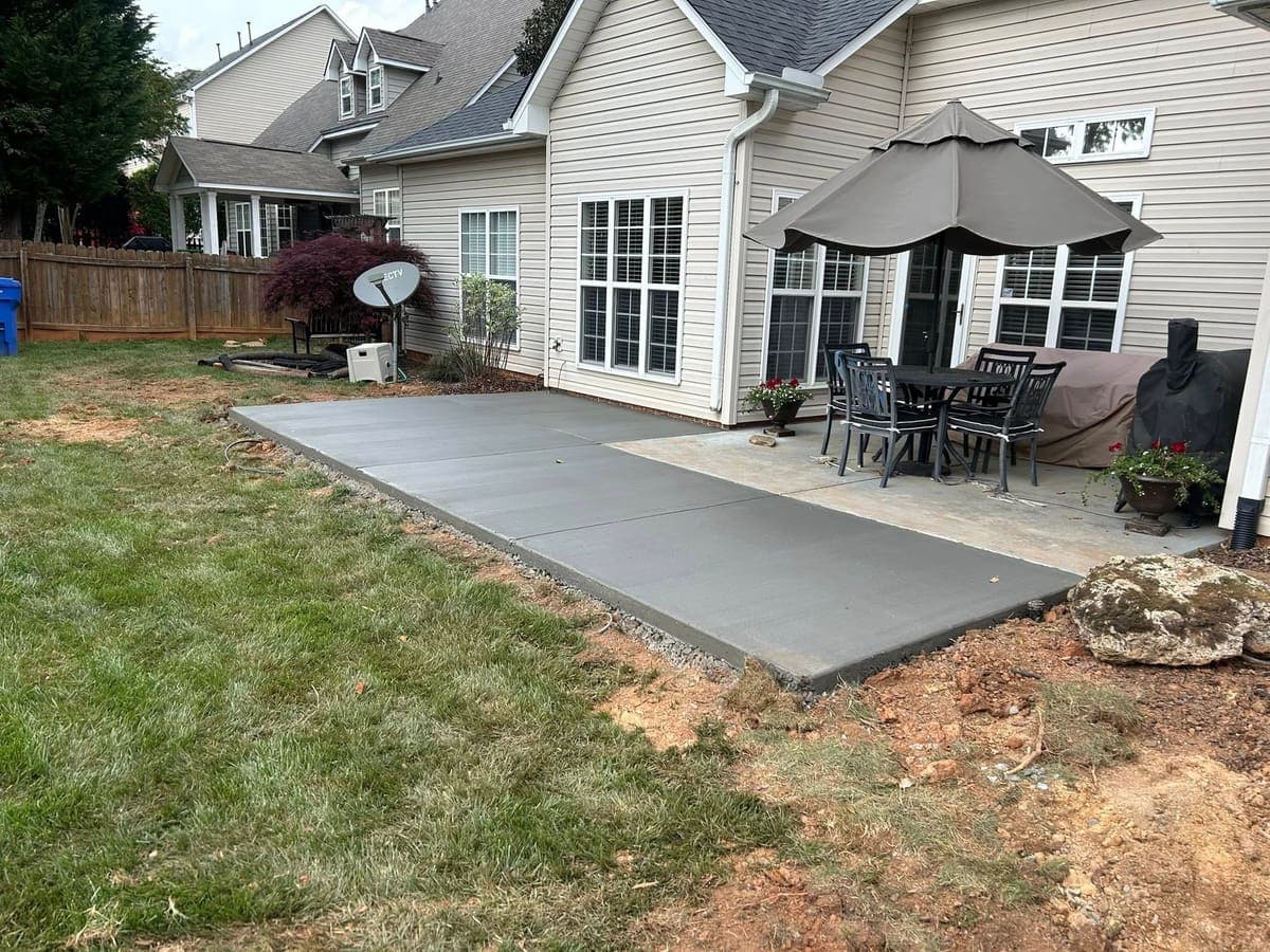Custom Concrete Patio Additions project completed in Wake Forest, NC by Local Concrete Contractor — pay-on-completion contractor, no deposit required, licensed and insured in North Carolina.