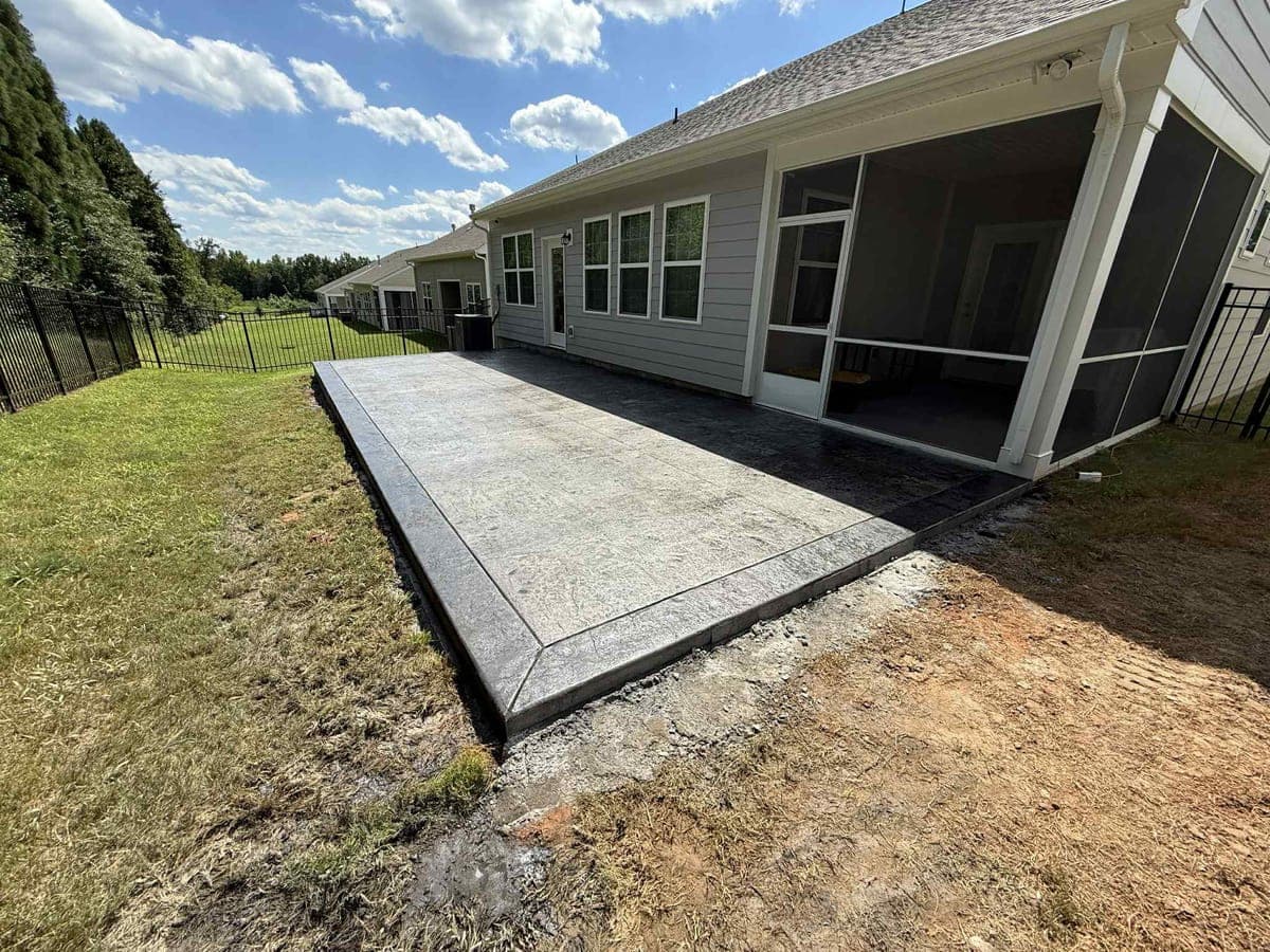 Professional Stamped Concrete Patios installation in Wake Forest, North Carolina by Local Concrete Contractor — commercial-grade base prep, 6-inch compacted aggregate, expansion joints sawn within 12 hours.